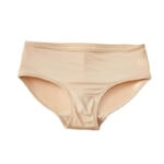 Hudfärgade dambyxor mot vit bakgrund. Push up-trosa med vadderad bakdel